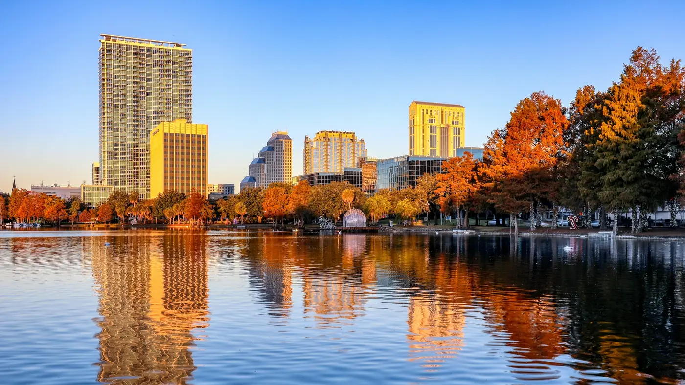 Downtown Orlando skyline reflected in Lake Eola at sunrise